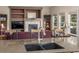 Modern kitchen with stone countertops, stainless steel sink and fixtures and an inviting living space with fireplace at 5048 Rocky Mountain Dr, Castle Rock, CO 80109