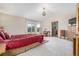 Spacious primary bedroom with a vaulted ceiling, bright windows, and a doorway to the ensuite bathroom at 5048 Rocky Mountain Dr, Castle Rock, CO 80109