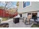 Private backyard patio featuring a fire pit, rocking chair, and egg chair for relaxing outdoors at 5237 W 100Th Ct, Westminster, CO 80020