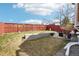 A well-maintained backyard featuring a patio area with outdoor seating and a privacy fence at 5237 W 100Th Ct, Westminster, CO 80020