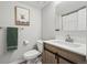 Updated bathroom with wood cabinet and shower/tub with art and a towel rack at 5237 W 100Th Ct, Westminster, CO 80020