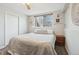 Bedroom featuring a ceiling fan and large window at 5237 W 100Th Ct, Westminster, CO 80020