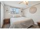 Bedroom featuring a ceiling fan and large window at 5237 W 100Th Ct, Westminster, CO 80020