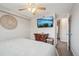 Cozy bedroom featuring a mounted flat screen tv and dresser at 5237 W 100Th Ct, Westminster, CO 80020