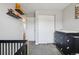 A bedroom with a black dresser, gray carpet and a white closet door at 5237 W 100Th Ct, Westminster, CO 80020