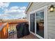 A deck with a grill and a sliding glass door leading to the house at 5237 W 100Th Ct, Westminster, CO 80020