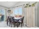 Bright dining room showcasing a sliding glass door, hardwood floors, and stylish lighting at 5237 W 100Th Ct, Westminster, CO 80020