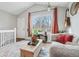 Bright living room featuring large window, hardwood floors, and cozy seating at 5237 W 100Th Ct, Westminster, CO 80020