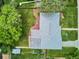An aerial view of a home with a well-maintained lawn, mature trees, and an inviting outdoor space at 8490 E Davies Pl, Centennial, CO 80112