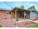 Backyard patio with a lovely potted plant and a view of the yard's landscaping at 8490 E Davies Pl, Centennial, CO 80112
