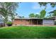 Lovely backyard with well-maintained lawn, landscaping and a covered patio area at 8490 E Davies Pl, Centennial, CO 80112