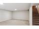 Basement featuring neutral carpet, neutral paint, and access to stairs at 8490 E Davies Pl, Centennial, CO 80112