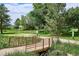 A bridge and paved walkway can be seen in a photo of the local community park at 8490 E Davies Pl, Centennial, CO 80112