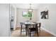 Chic dining area with a modern light fixture and sleek black furniture at 8490 E Davies Pl, Centennial, CO 80112