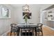 Stylish dining room with modern decor, a statement art piece, and bright lighting at 8490 E Davies Pl, Centennial, CO 80112