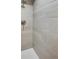 Modern shower with gray tiling and a sleek brushed nickel shower head at 8490 E Davies Pl, Centennial, CO 80112