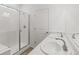 Bright bathroom showcasing a shower with glass door and double sink vanity with modern fixtures at 13342 E 110Th Way, Commerce City, CO 80022
