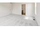 Spacious carpeted bedroom with bathroom access at 13342 E 110Th Way, Commerce City, CO 80022