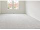 Spacious carpeted bedroom with two windows providing natural light at 13342 E 110Th Way, Commerce City, CO 80022