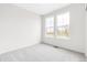 Bright, carpeted bedroom featuring two windows that let in ample natural light at 13342 E 110Th Way, Commerce City, CO 80022