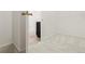Walk-in closet adjacent to bathroom with carpet and white walls, offering ample storage at 13342 E 110Th Way, Commerce City, CO 80022