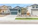 Inviting home with attached garage, manicured front yard, and attractive curb appeal in a neighborhood setting at 13342 E 110Th Way, Commerce City, CO 80022