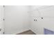 Bright laundry room with washer and dryer hookups, storage shelves, and wood-look floors at 13342 E 110Th Way, Commerce City, CO 80022