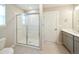 Bathroom featuring glass door shower, a toilet and gray vanity with white countertop at 21854 E 9Th Pl, Aurora, CO 80018