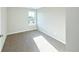 Bright bedroom featuring neutral walls, plush carpet, and a window offering natural light at 21854 E 9Th Pl, Aurora, CO 80018