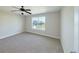 Bedroom with carpet, a ceiling fan and a window with a view of the neighborhood at 21854 E 9Th Pl, Aurora, CO 80018