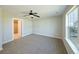 Bright bedroom with neutral carpet, ceiling fan, and ample closet space at 21854 E 9Th Pl, Aurora, CO 80018