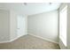 Cozy bedroom featuring neutral carpet, closet, and a bright window at 21854 E 9Th Pl, Aurora, CO 80018