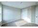 Comfortable bedroom with neutral walls, soft carpet, and a white door, offering a serene space at 21854 E 9Th Pl, Aurora, CO 80018