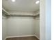 Walk-in closet featuring neutral wall color and shelving for optimal storage at 21854 E 9Th Pl, Aurora, CO 80018