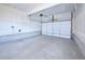 Spacious two car garage with a modern door, opener and ample space for storage and parking at 21854 E 9Th Pl, Aurora, CO 80018