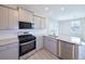 Well-equipped kitchen with stainless steel appliances, granite counters, and tile backsplash at 21854 E 9Th Pl, Aurora, CO 80018