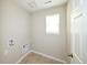 Functional laundry room ready for appliances and complete with tile flooring at 21854 E 9Th Pl, Aurora, CO 80018