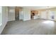 Open-concept living area with wood floors leading to a modern kitchen and dining area at 21854 E 9Th Pl, Aurora, CO 80018