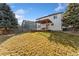 Elevated backyard view of the home, showcasing a large deck and pergola at 447 Woodson Dr, Erie, CO 80516