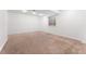 Unfinished basement with neutral carpeting and single window at 447 Woodson Dr, Erie, CO 80516