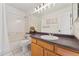 Clean bathroom with single sink vanity and shower/tub combo at 447 Woodson Dr, Erie, CO 80516