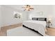 King-size bed, ceiling fan and neutral decor in main bedroom at 447 Woodson Dr, Erie, CO 80516