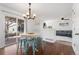 Bright dining area with a view into the living room and back yard at 447 Woodson Dr, Erie, CO 80516