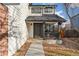 Inviting front entrance with a covered porch and walkway at 447 Woodson Dr, Erie, CO 80516