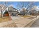 Two-story home with a two-car garage and brick walkway at 447 Woodson Dr, Erie, CO 80516