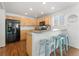 Modern kitchen with black appliances and light wood cabinets at 447 Woodson Dr, Erie, CO 80516