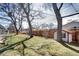 Private backyard with mature trees and lawn at 6737 Lee St, Arvada, CO 80004