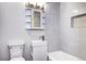 Modern bathroom with a tub, light fixtures and a stylish sink at 6737 Lee St, Arvada, CO 80004