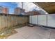 Private patio area with concrete flooring and partial fence at 2500 S York St # 107, Denver, CO 80210