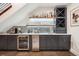 Modern bar features sleek cabinetry, wine storage, under-counter refrigerator, and ample counter space at 1511 S Pennsylvania St, Denver, CO 80210